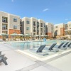 Resort-style swimming pool with lounge seating