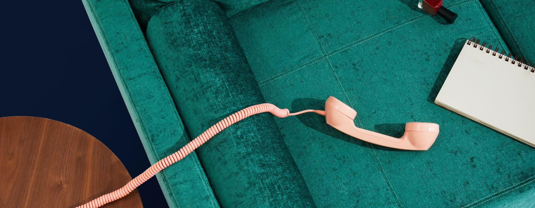 an aqua sof and a peach phone